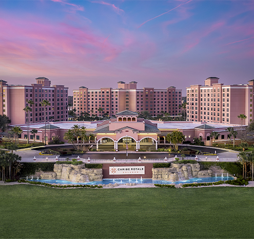 a large building with a pool and a fountain