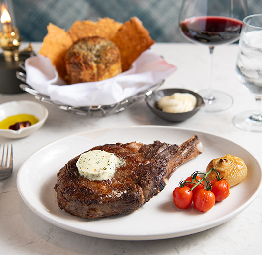 a plate of steak and vegetables on a table