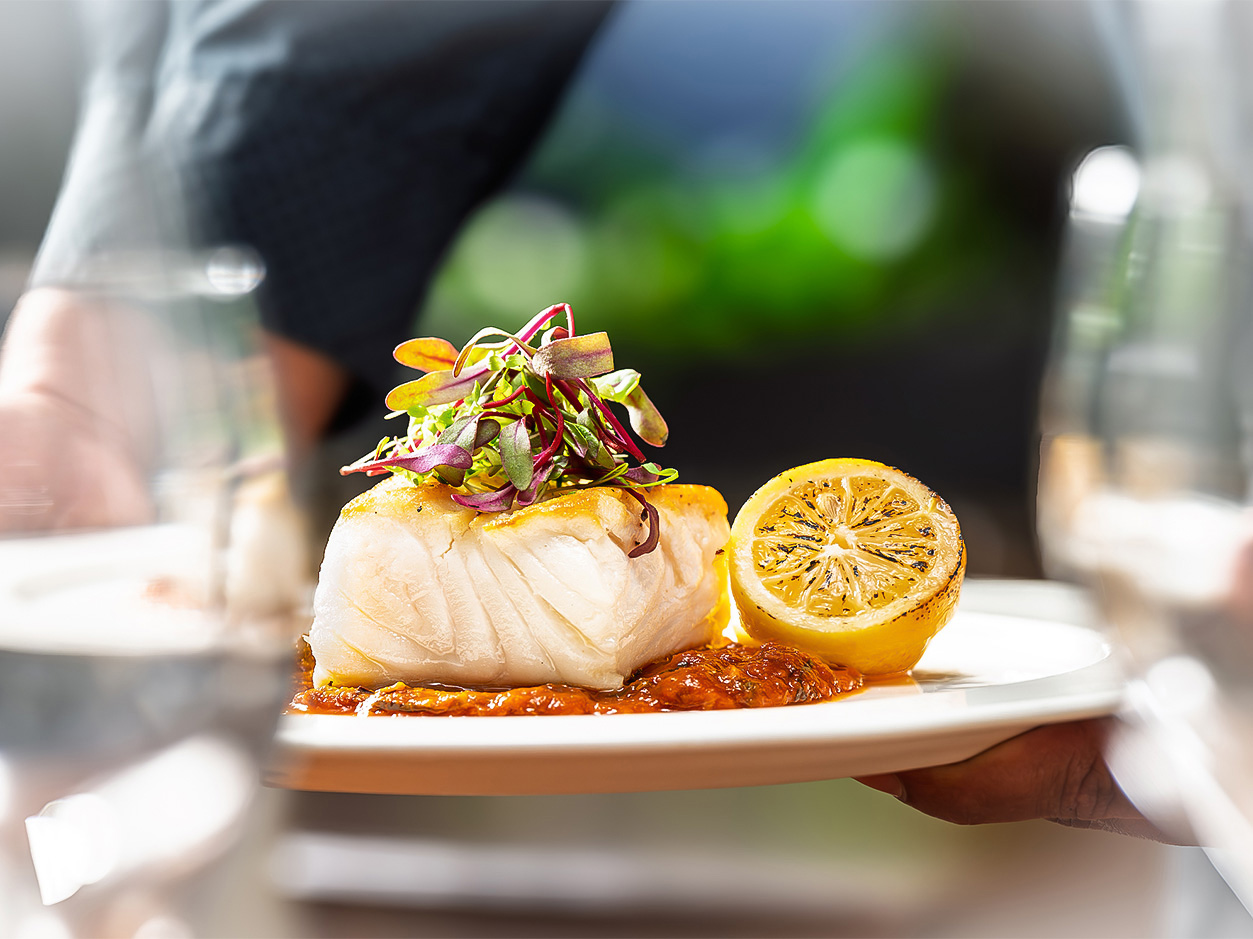 a plate of food with a lemon wedge