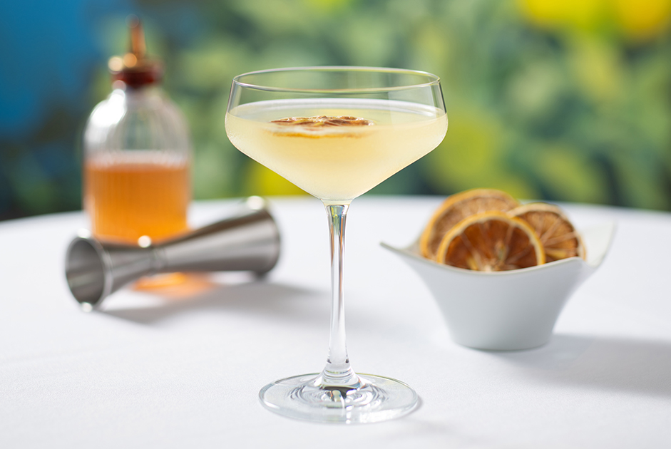 a glass of yellow liquid