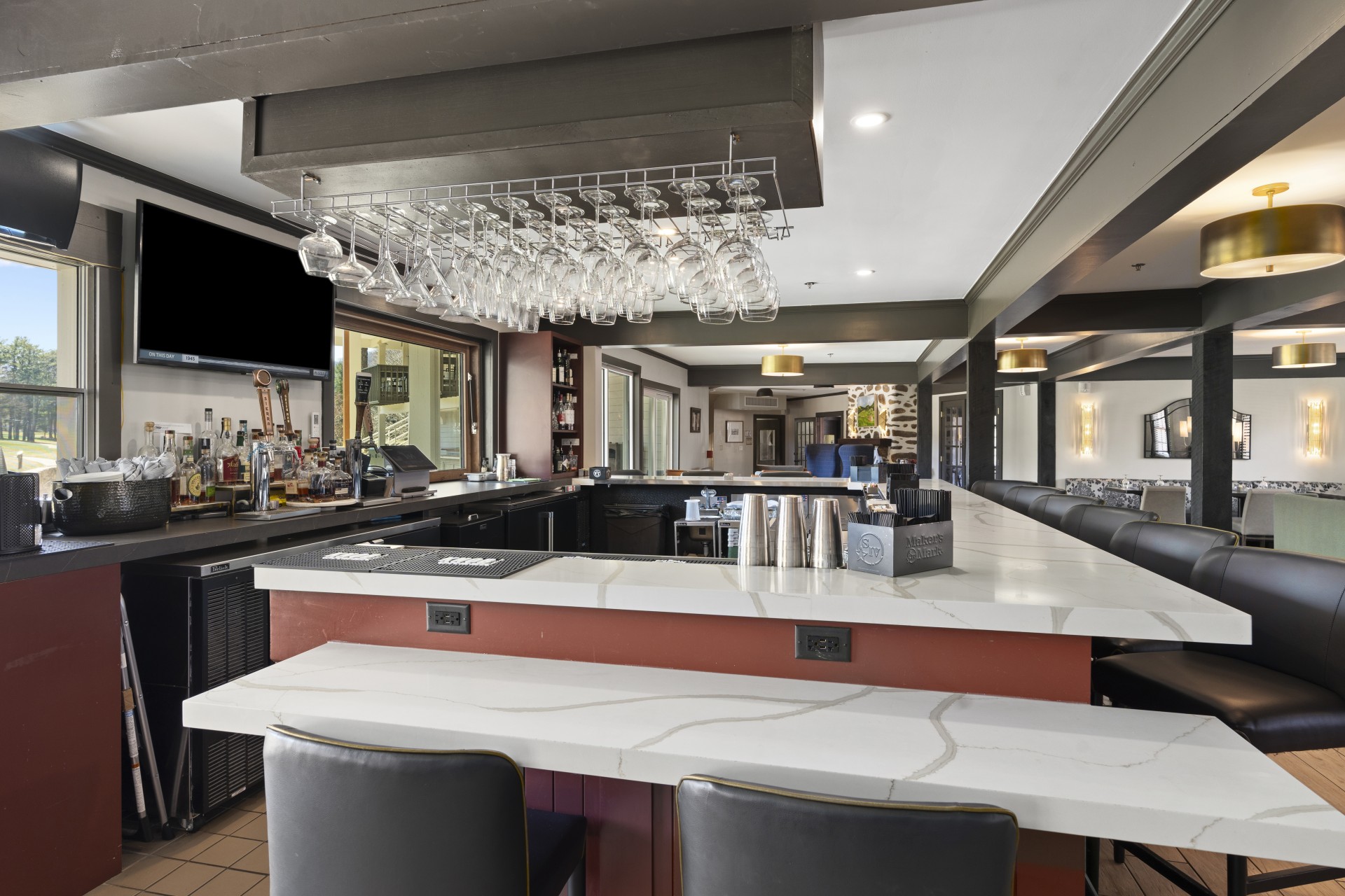 a bar with a bar and chairs