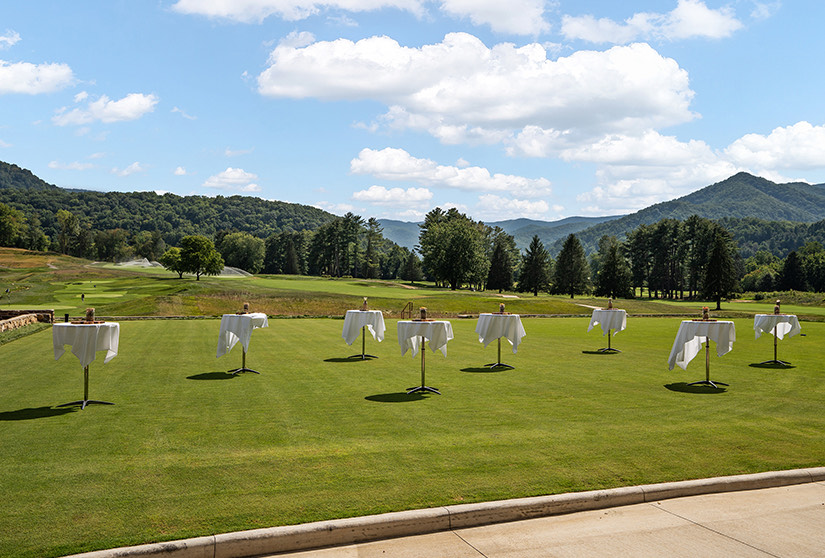 a golf course with white golf clubs