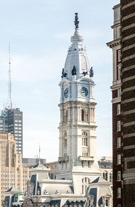 a large white tower with a clock on top