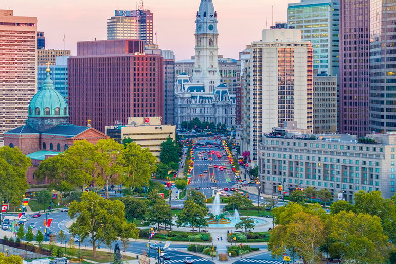 a city with a fountain and buildings