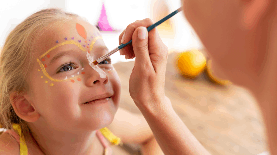 a child getting her face painted