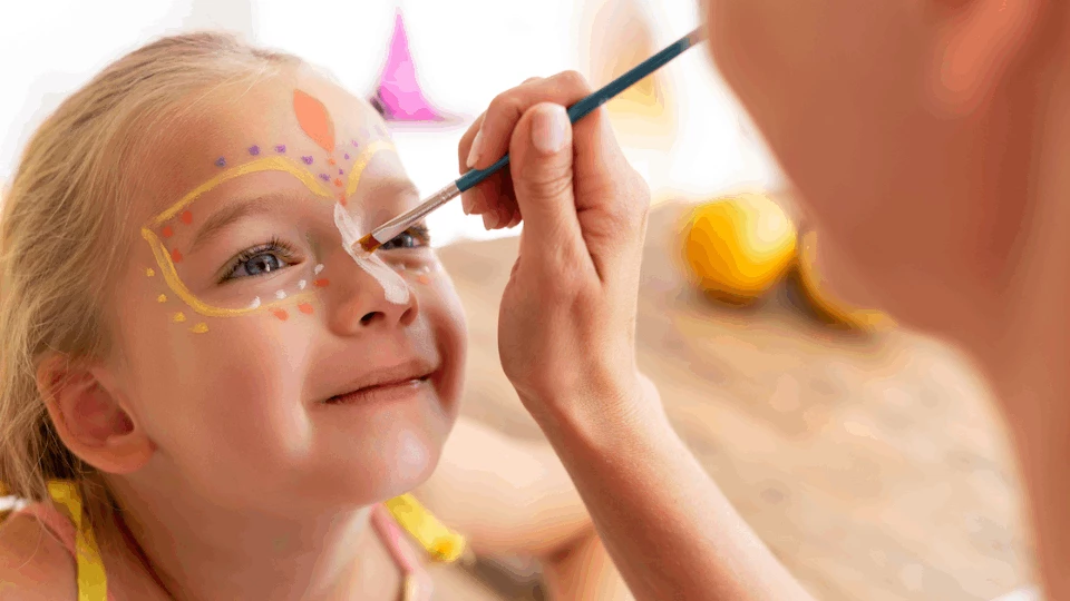 a child getting her face painted