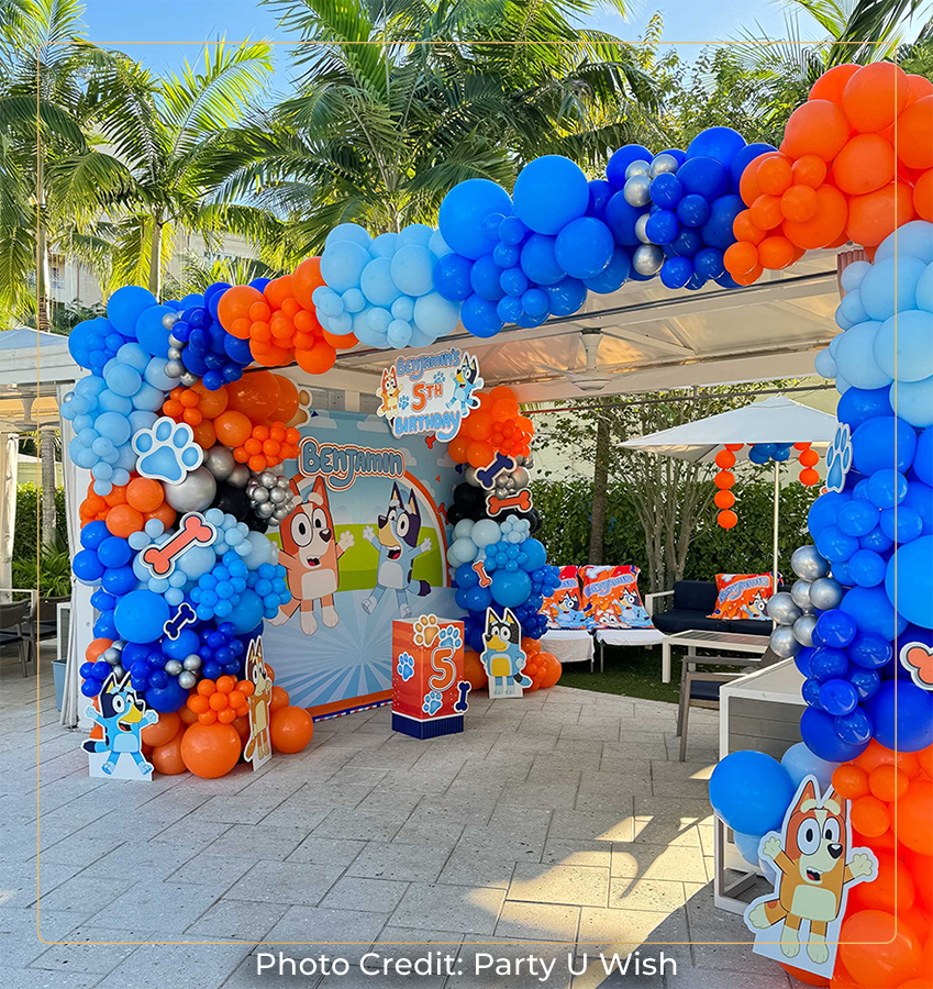 a balloon arch with animal and dog theme