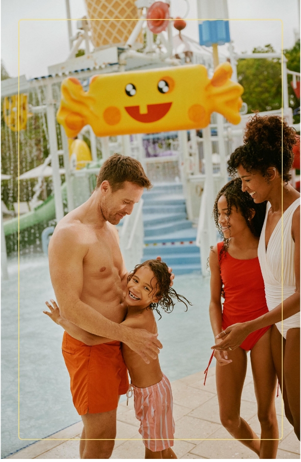 a man and woman holding a girl