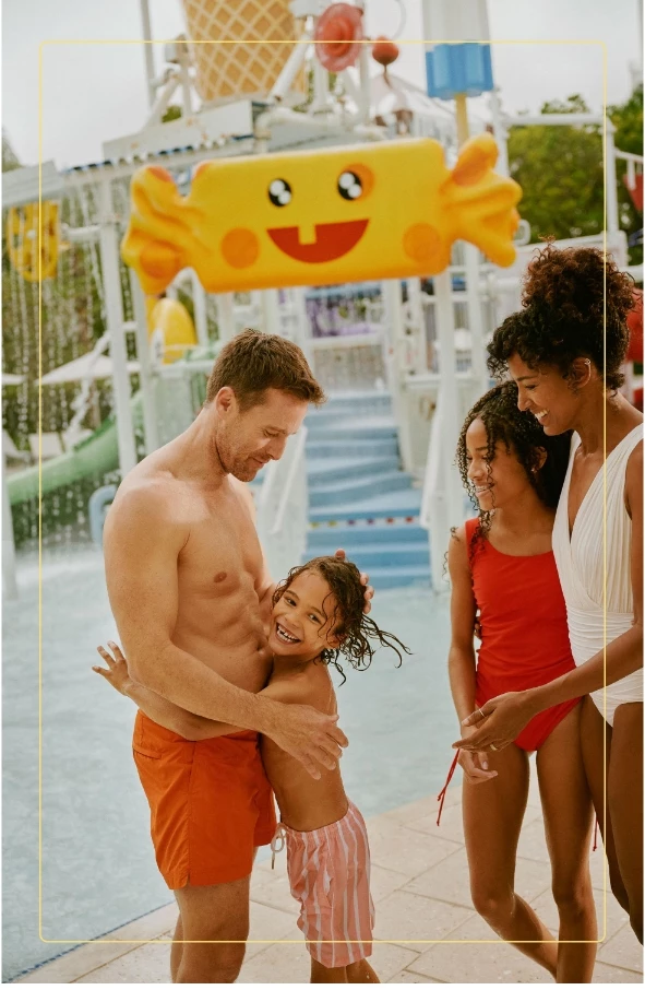 a man and woman holding a girl