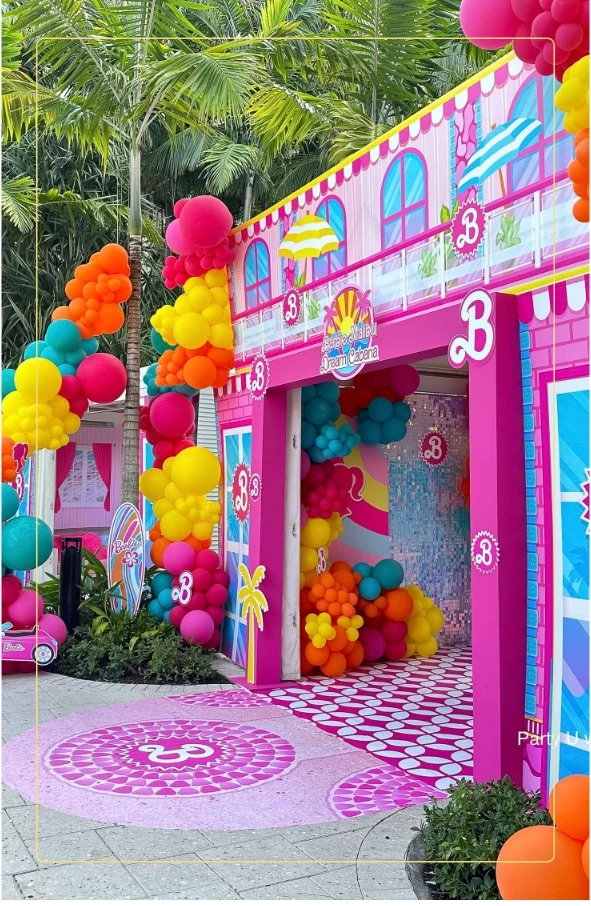 a pink house with balloons