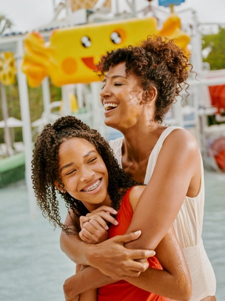 a woman hugging another woman
