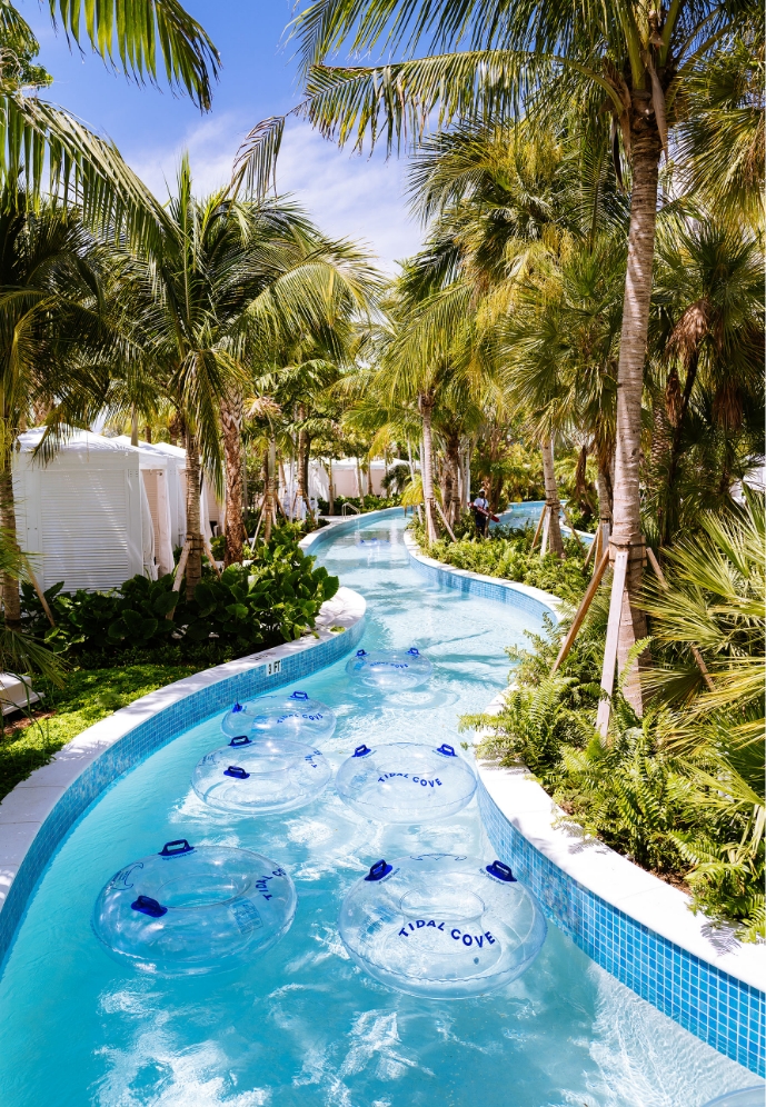 a water way with clear tubes and trees