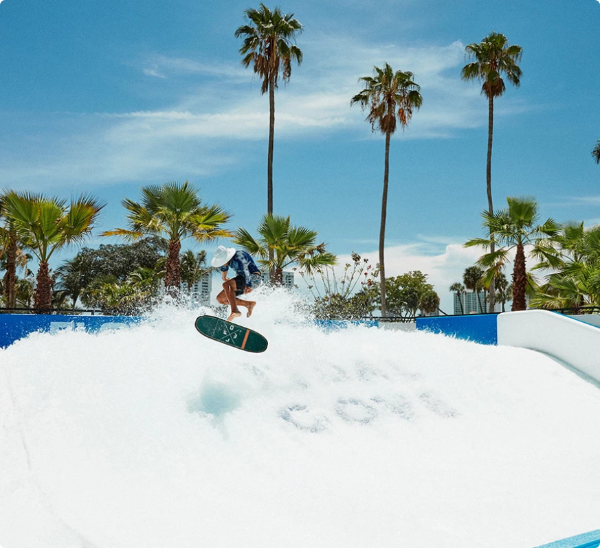 a person on a surfboard in a pool