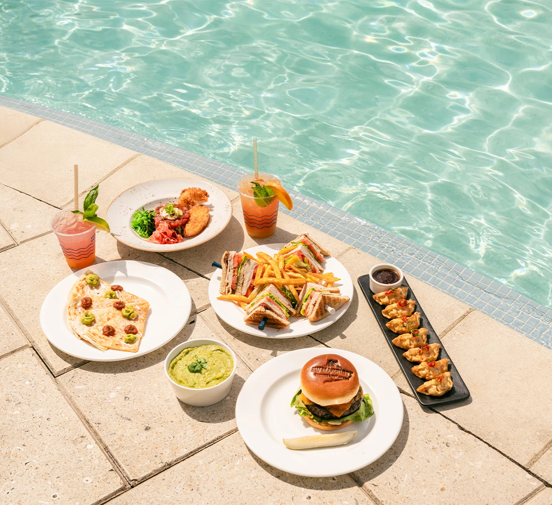 plates of food on a pool side