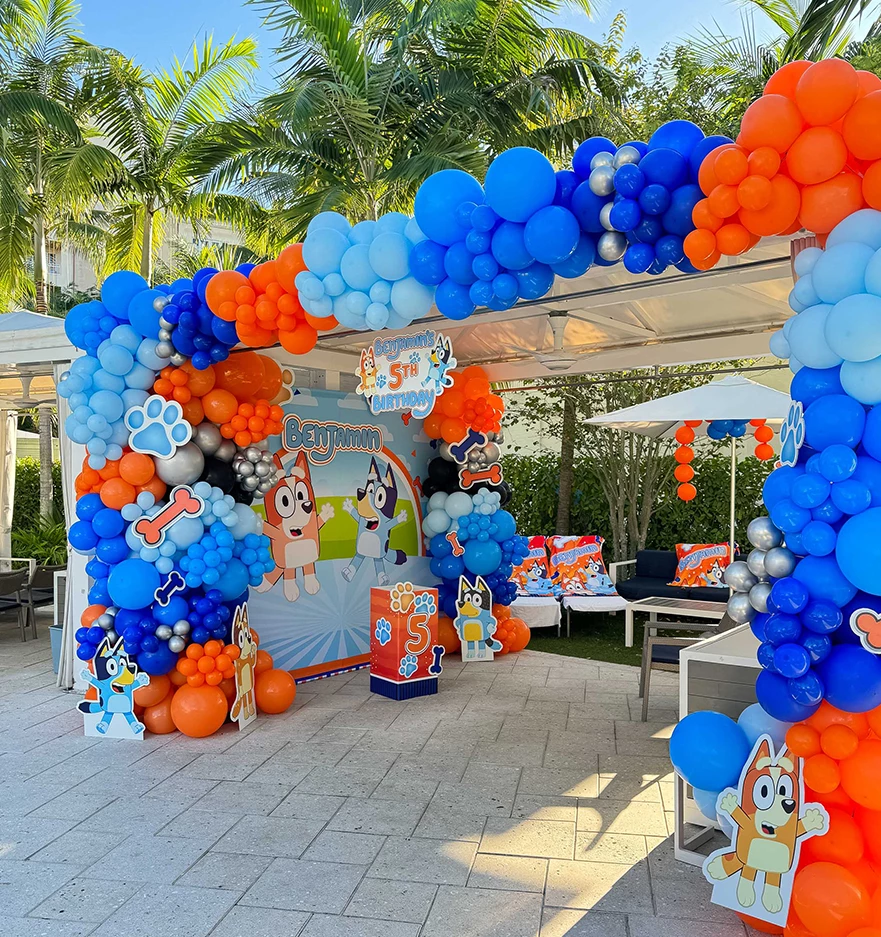 a balloon arch with animal and dog theme