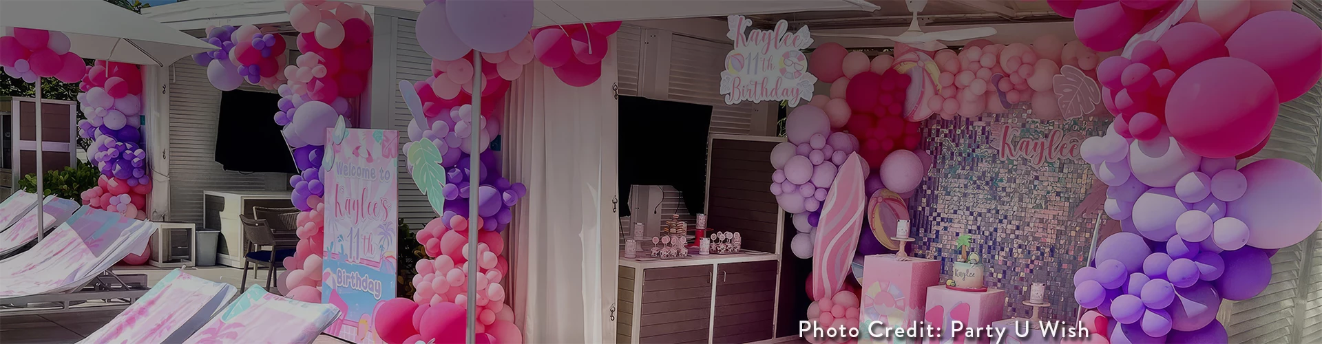a pink and purple balloon decorations