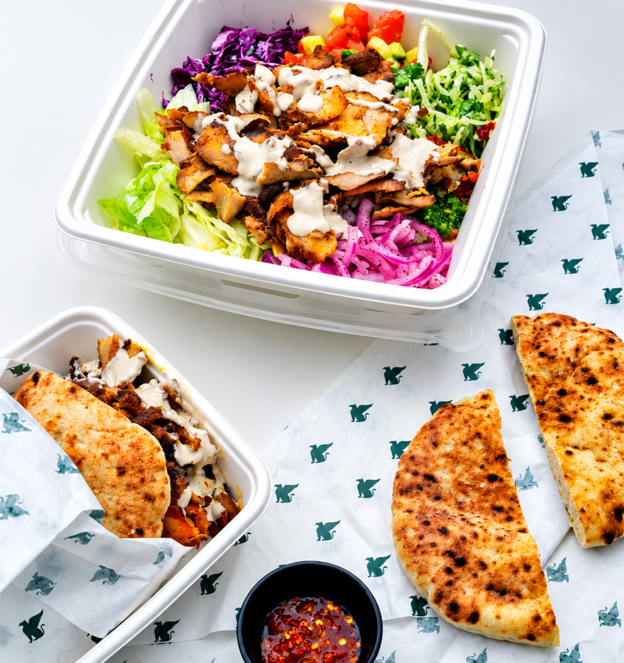 a salad and tortilla in a container