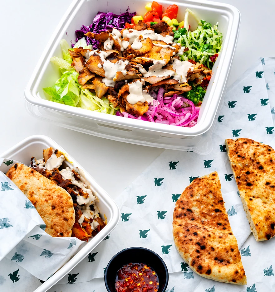 a salad and tortilla in a container