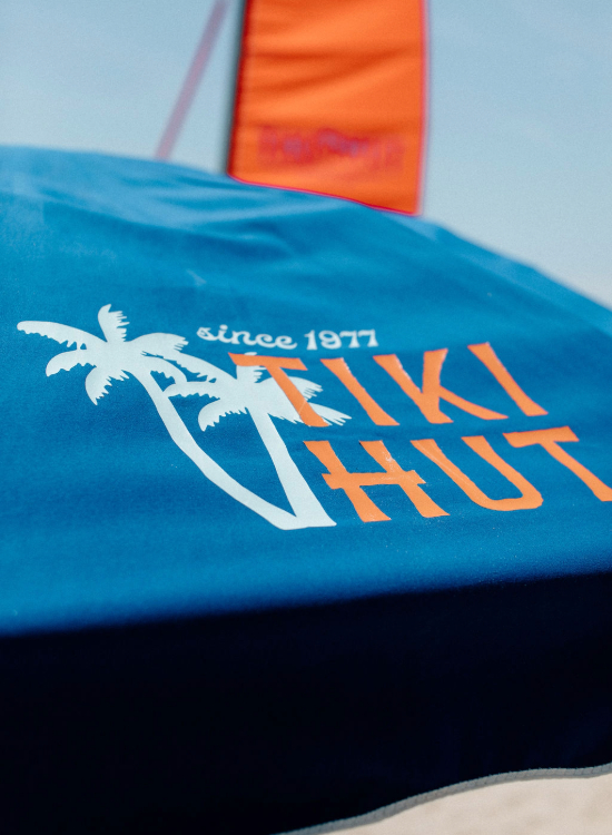 a blue tent with orange and white text