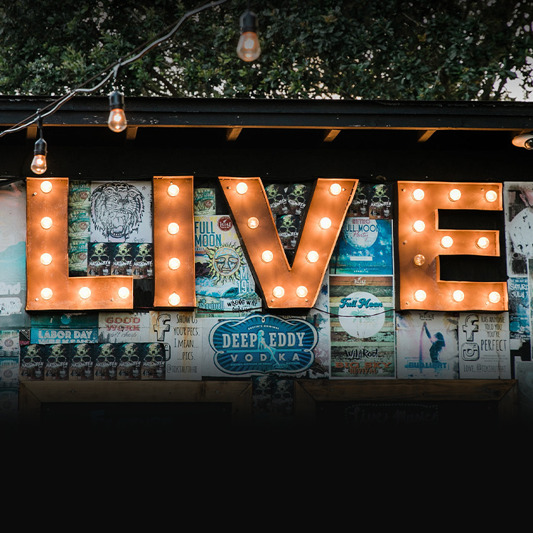 close up on the "LIVE" sign hung outdoors