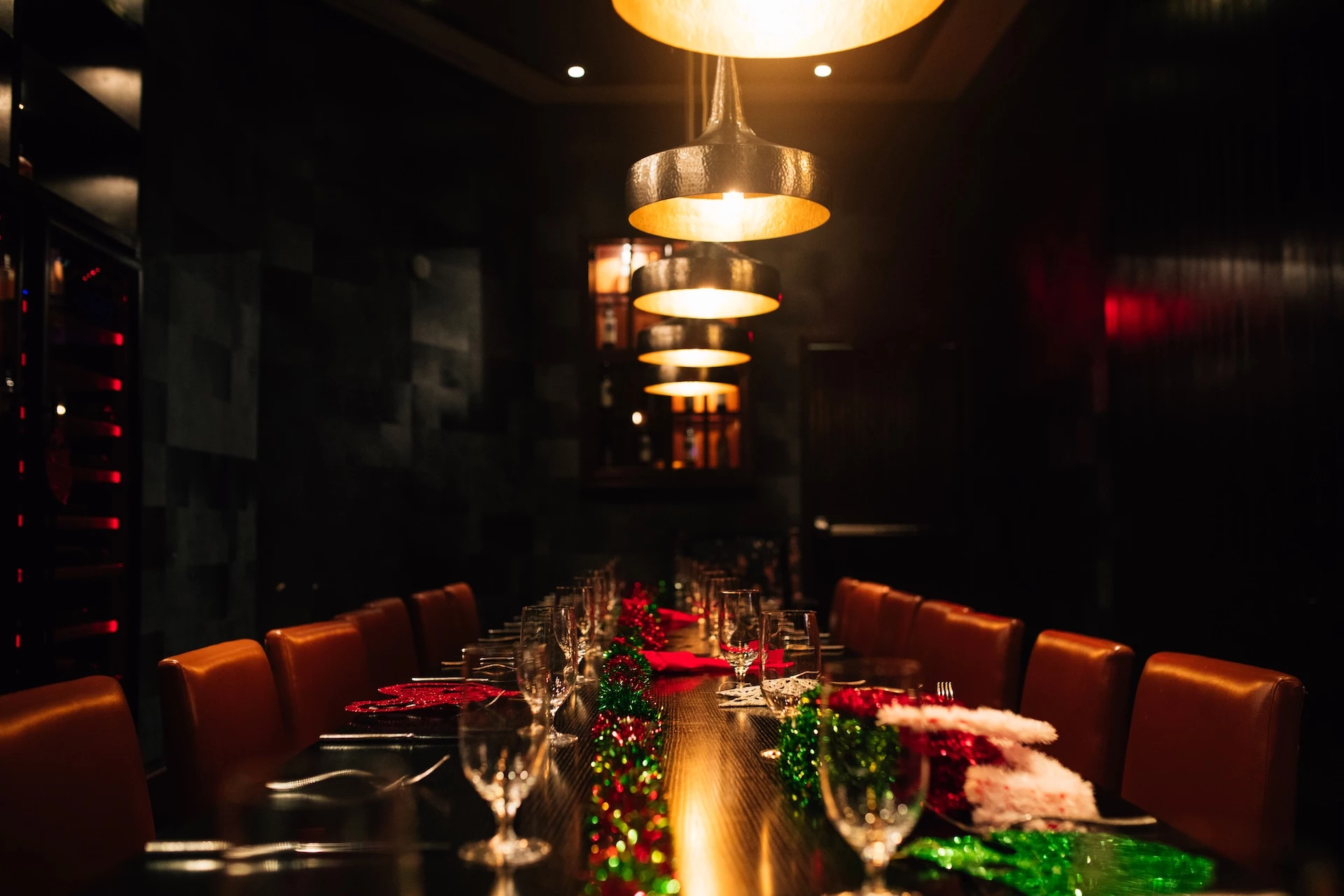 a long table with lights and glasses