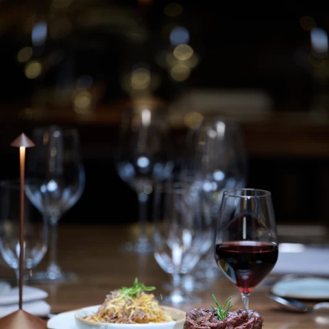 a plate of food and wine on a table