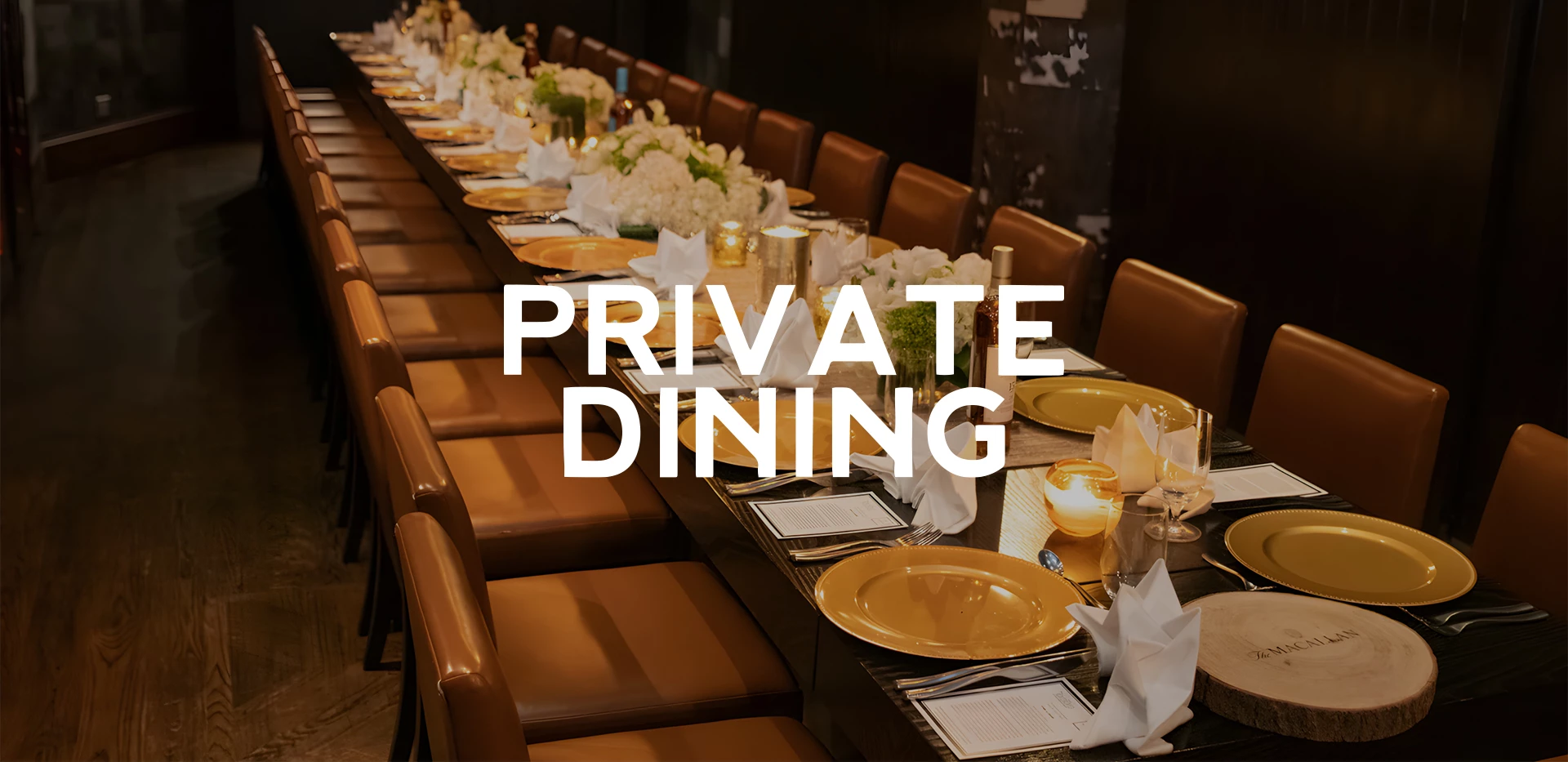 a long table with plates and flowers