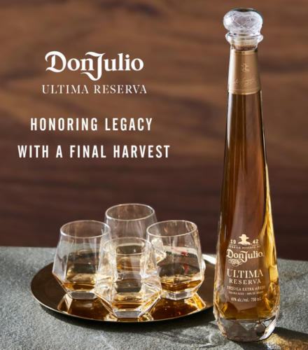 a bottle of liquor and several glasses on a tray