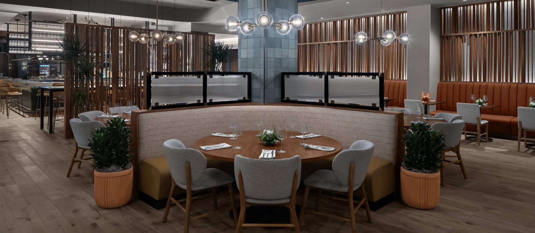 a round table with chairs and a chandelier