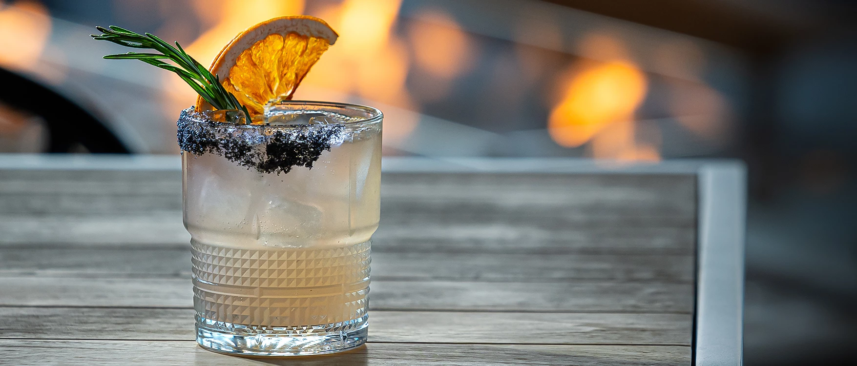 a glass with a plant in it