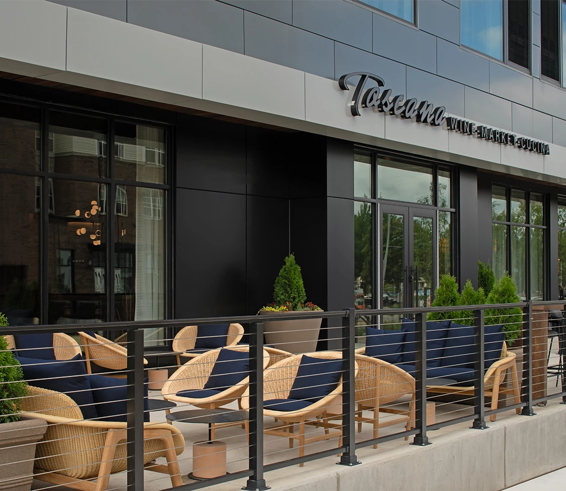 a building with chairs and tables outside