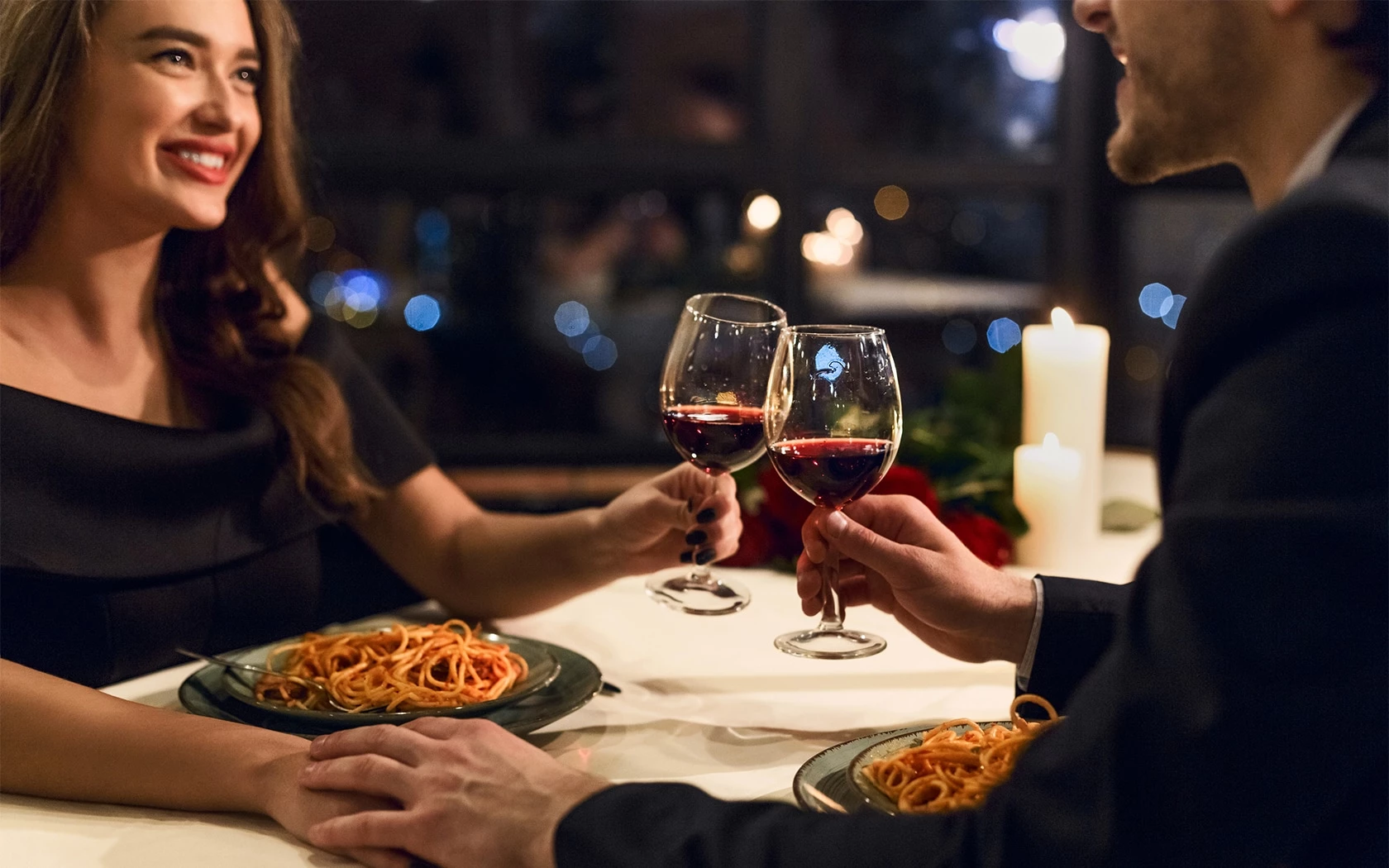 people holding wine glasses