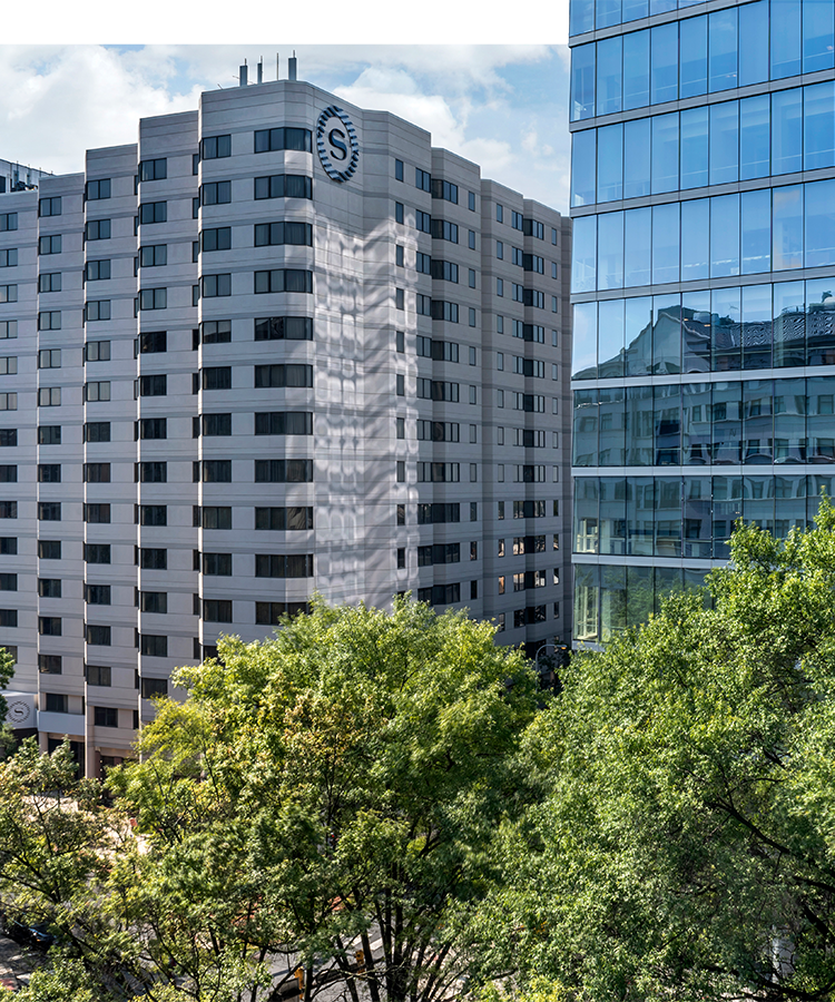 a building with trees in front of it