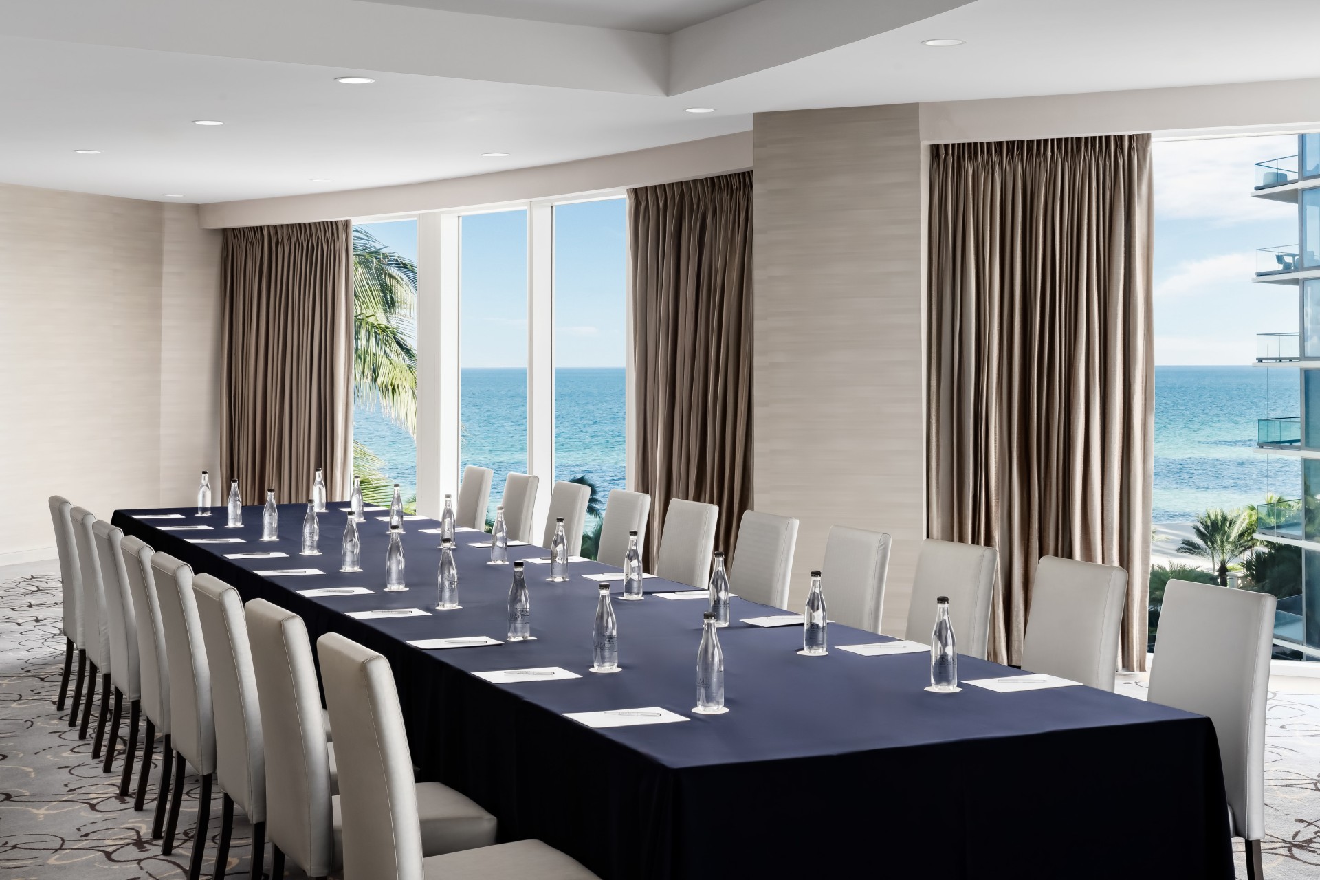 a long table with water bottles on it