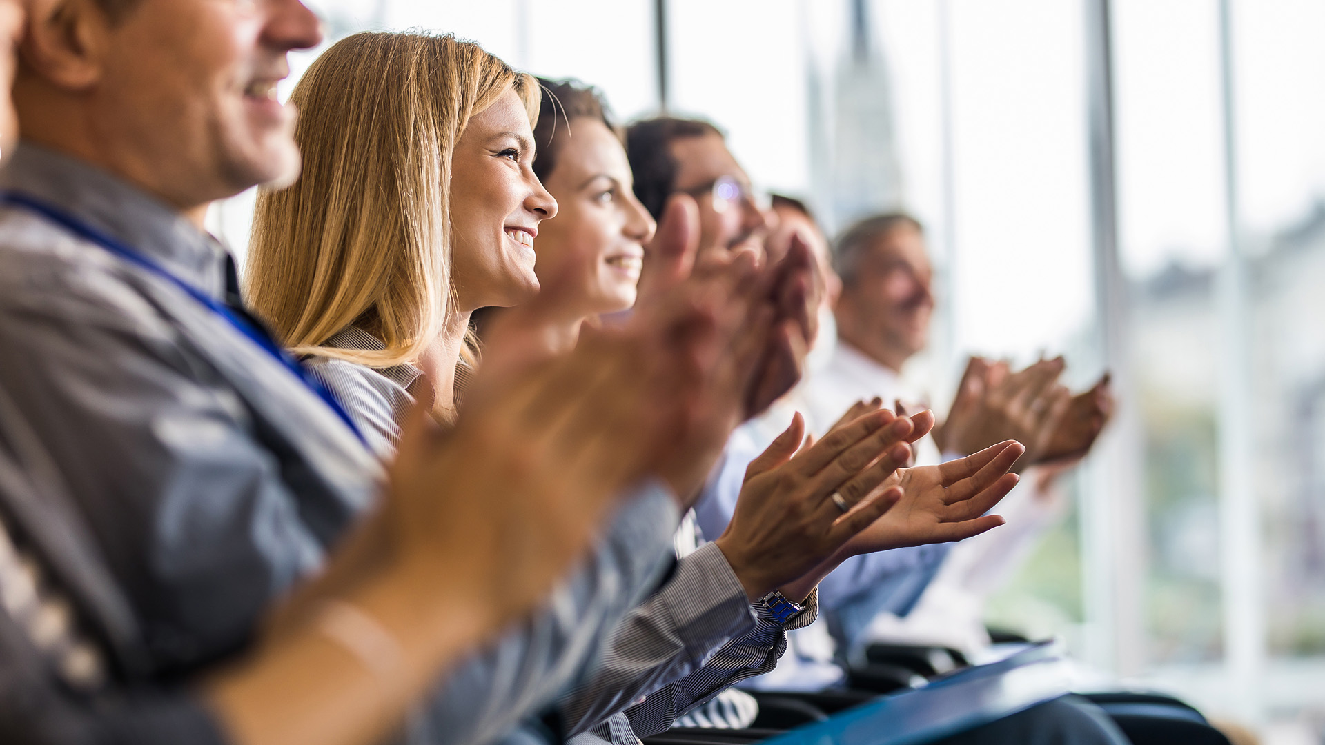 a group of people clapping