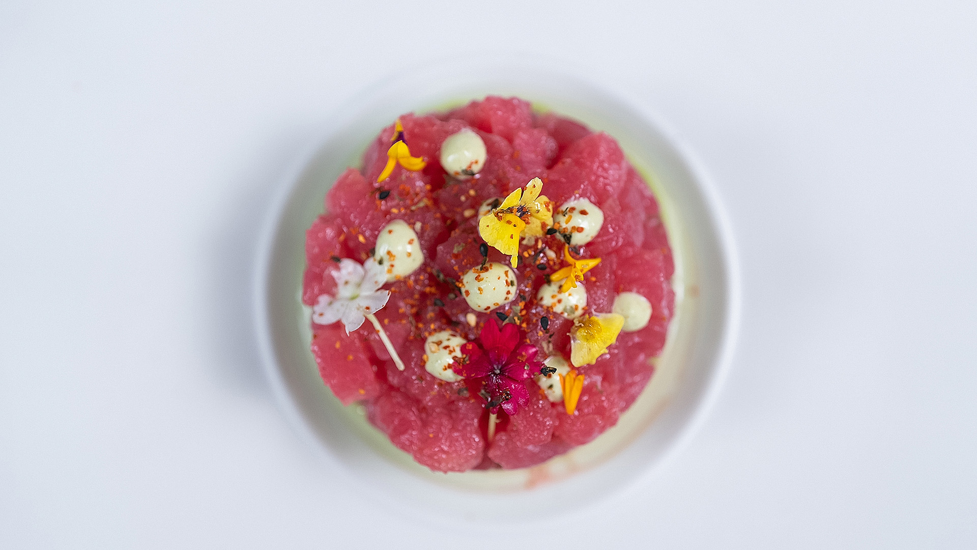 a plate of food with flowers and spices