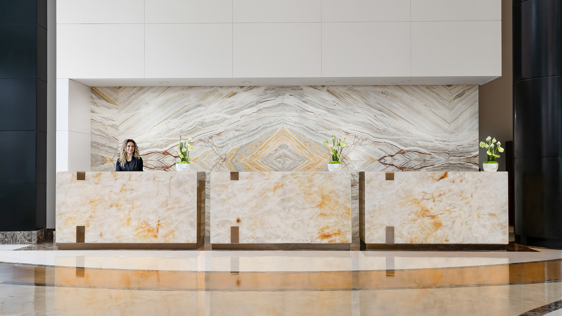 a woman standing behind a counter