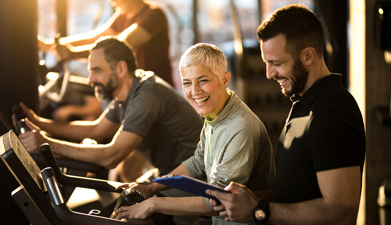 a group of people on treadmills