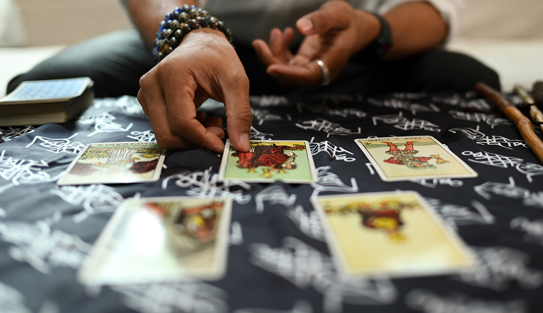 a person's hand holding a card