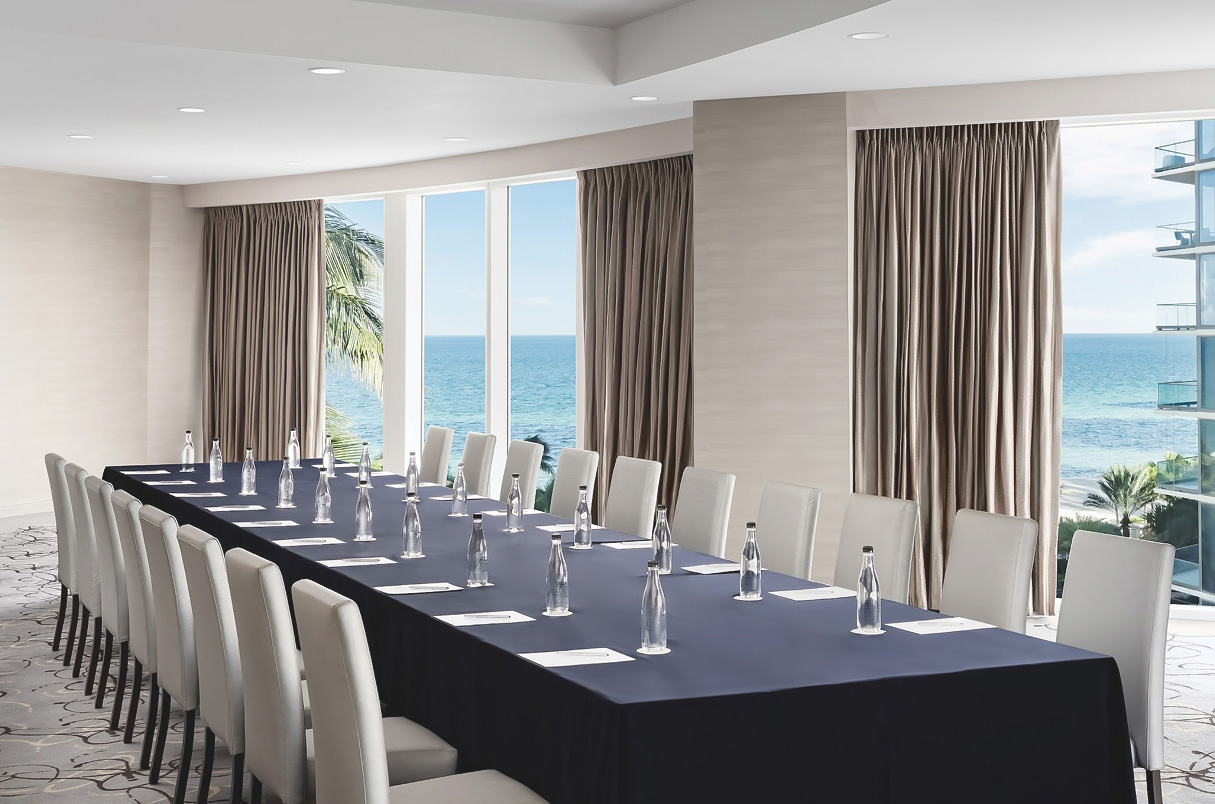 a long table with water bottles on it