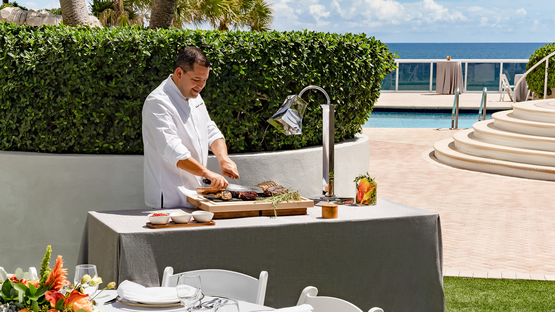 a man cooking food on a table