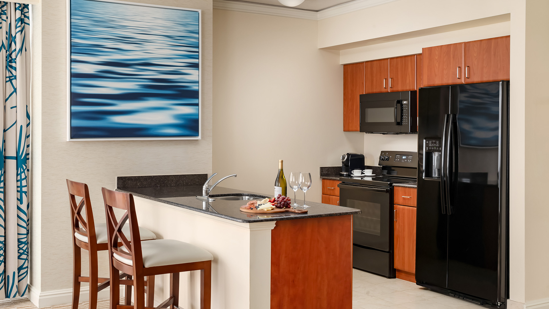 a kitchen with a black stove and a black appliances