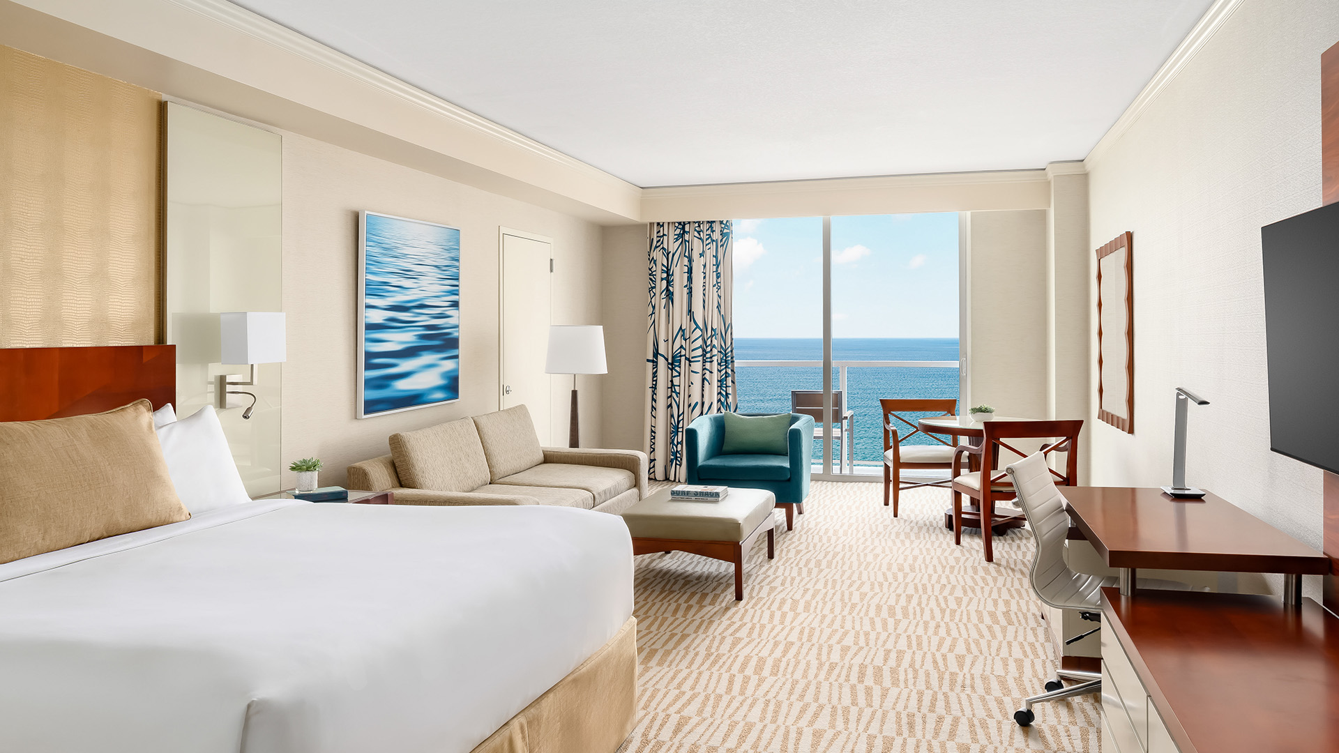 a room with a bed and chairs and a table