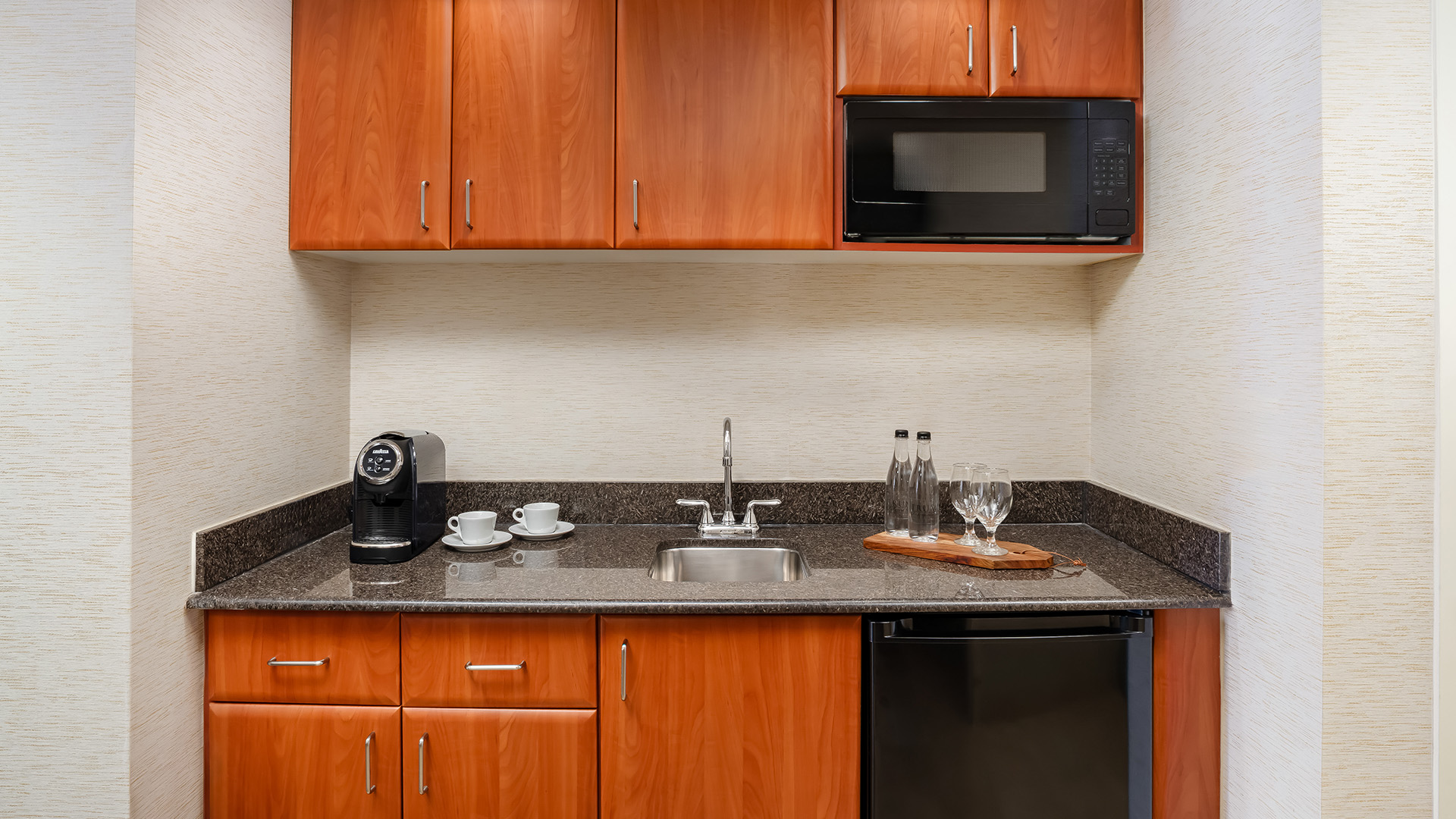 a kitchen with a microwave and a coffee machine