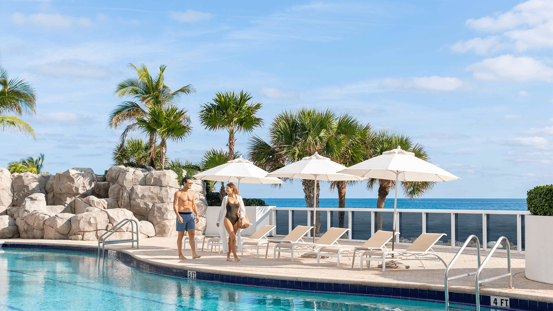 a group of people by a pool