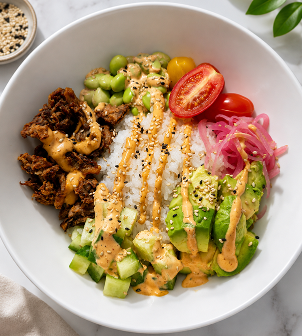 a bowl of food with sauces