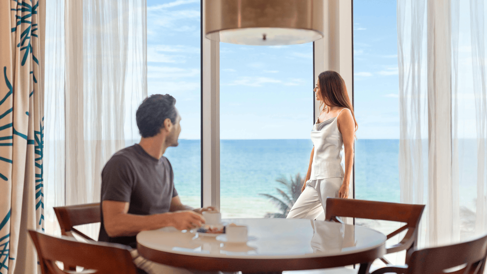 a man and woman looking at each other