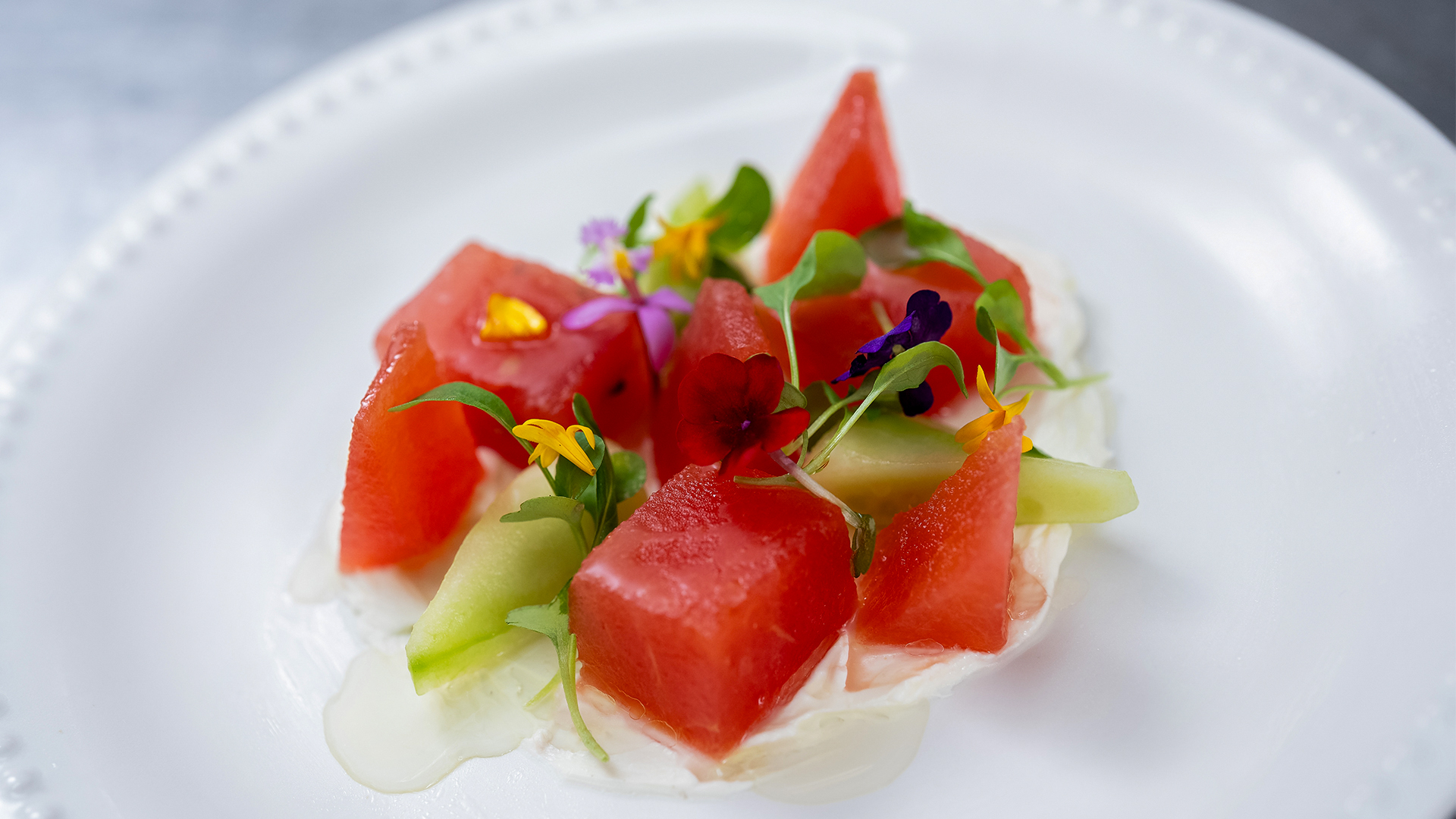 a plate of fruit and cream cheese