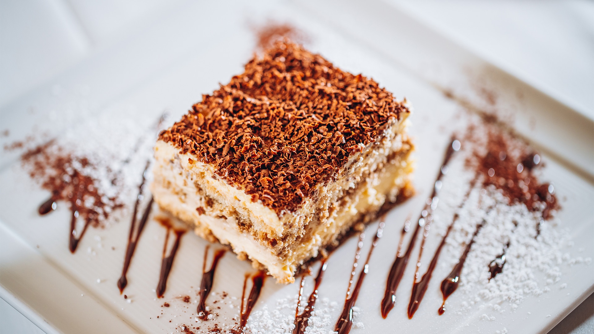 a piece of cake with chocolate on top