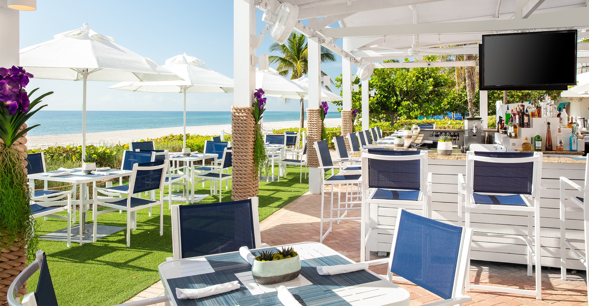 a restaurant with tables and chairs on a patio